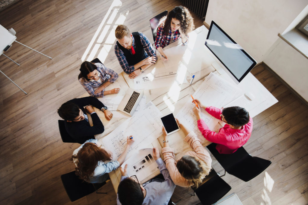Portrait of young perspective designers having meeting in office