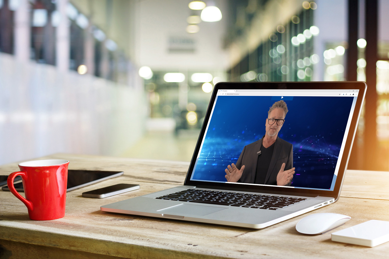 The picture shows our moderator for the AI competence course in accordance with the EU AI Regulation on a desktop monitor.